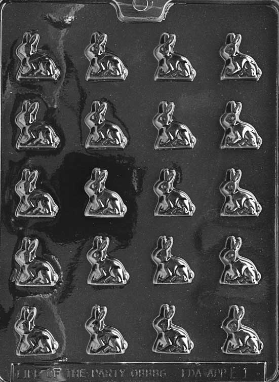 Tiny chocolate mold of bunny sitting upright with long ears and round body. Designed for mini treats.