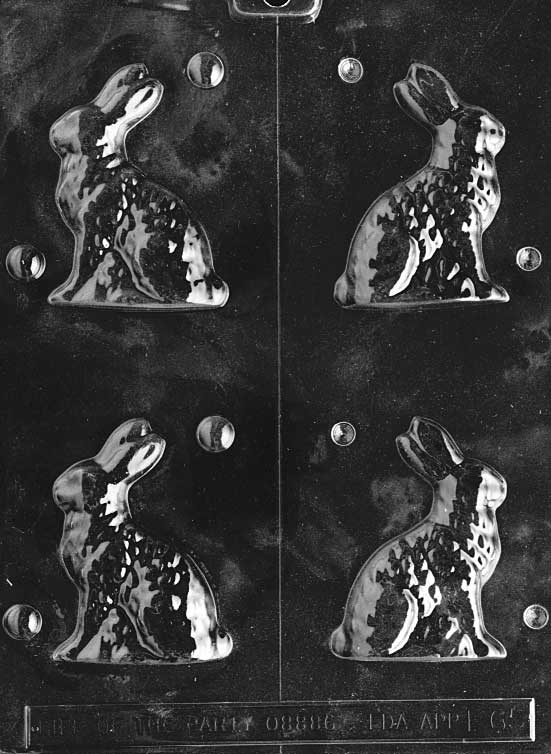 Chocolate mold of small bunny in upright seated position.