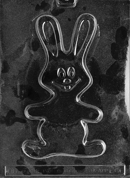 Large flat bunny chocolate mold with wide smile and expressive shape.