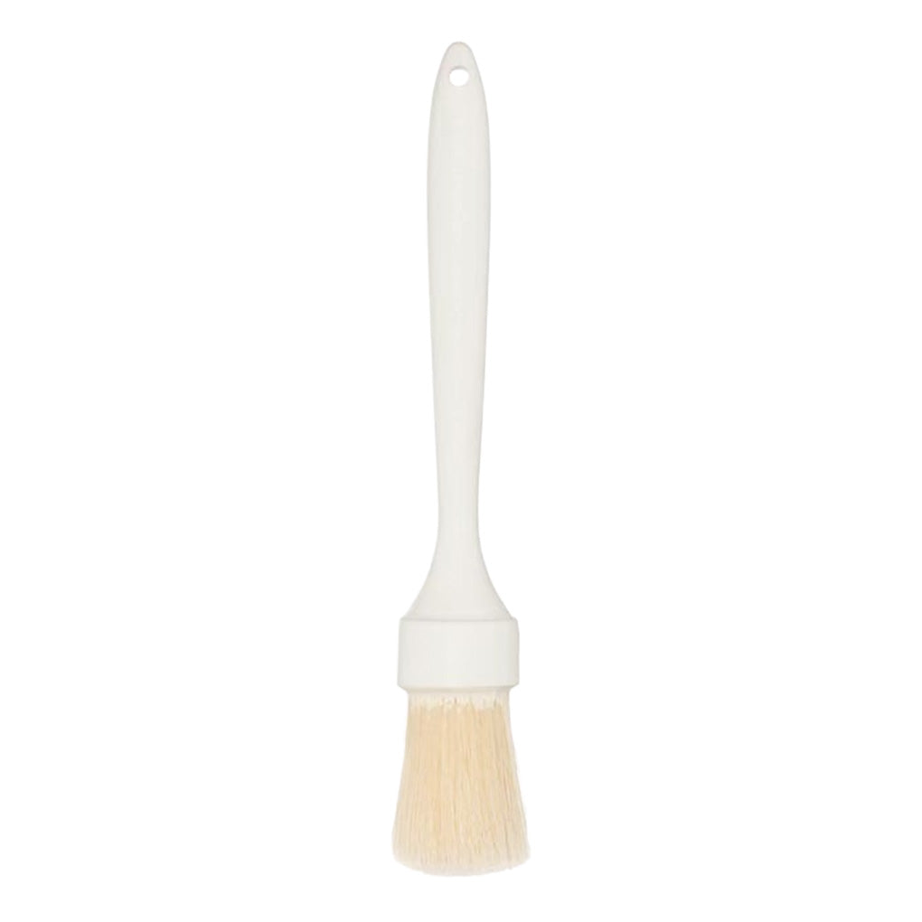 White pastry brush with cream bristles and a long plastic handle, isolated on a light background.