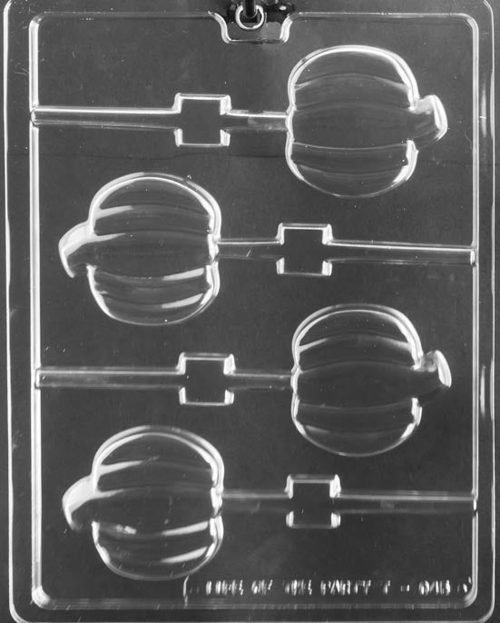 Clear lollipop mold with four pumpkin-shaped cavities featuring curved ridges and a small stem, each with built-in stick channels on a glossy plastic sheet.