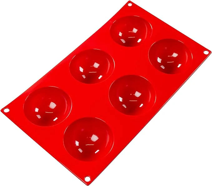 Fat Daddio's Silicone Baking Mold with six round cavities. Made from red food-grade silicone, flexible, non-stick, and temperature-safe from -40°F to 550°F.