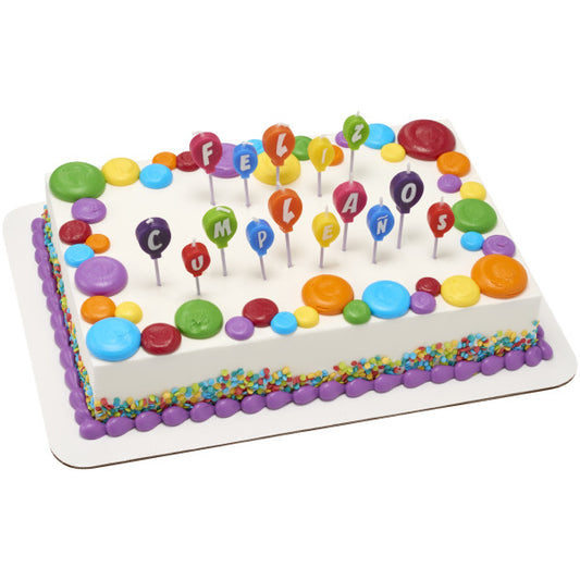Sheet cake decorated with colorful balloon candles spelling "Feliz Cumpleaños" and matching candy confetti