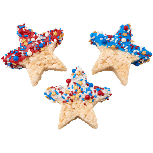 Three star-shaped sugar cookies decorated with red, white, and blue icing and topped with Firecracker Deluxe Sprinkle Blend, perfect for Fourth of July celebrations.