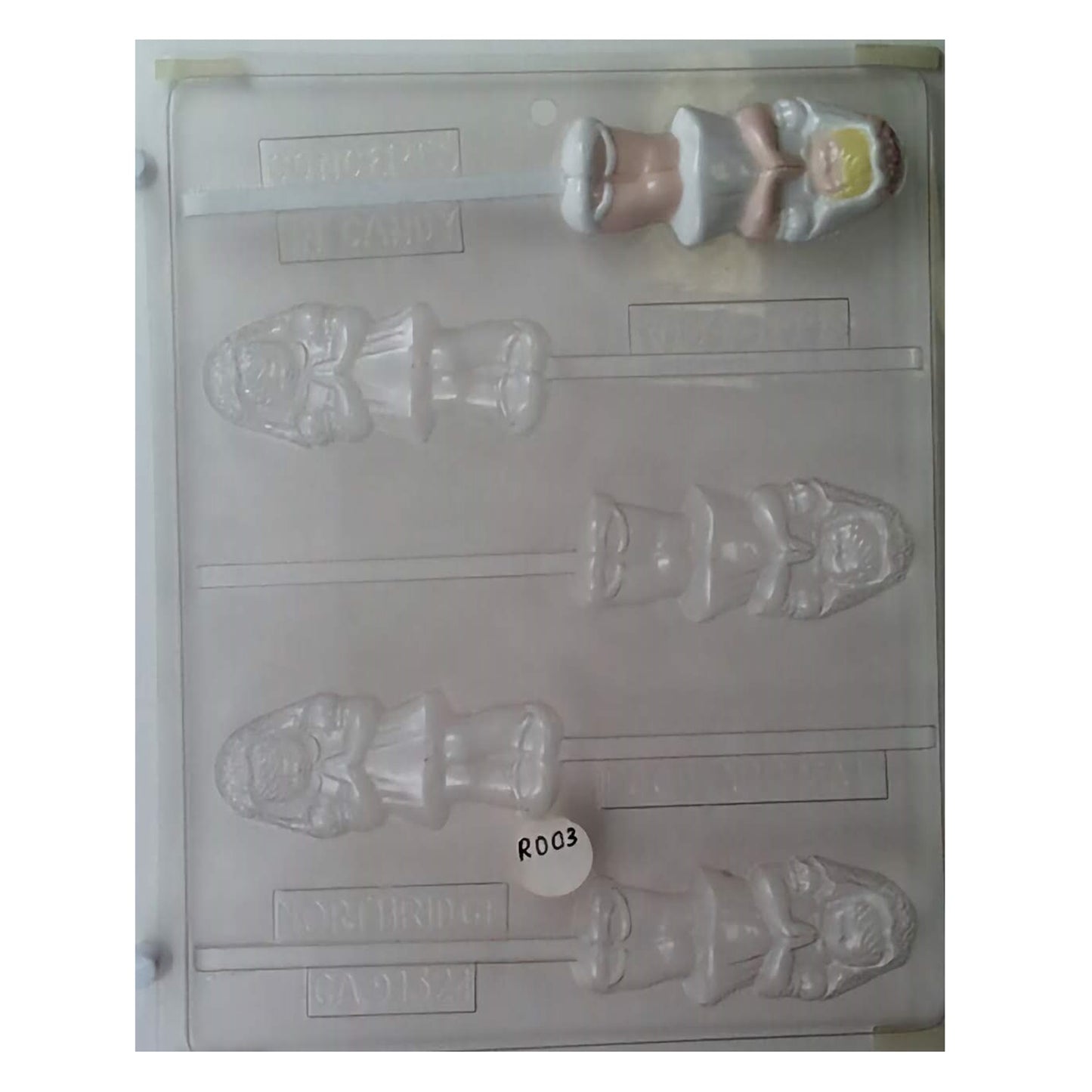A chocolate lollipop mold that captures the essence of a First Communion celebration, featuring a young girl in a flowing dress and veil, ideal for commemorating a young lady's religious milestone.