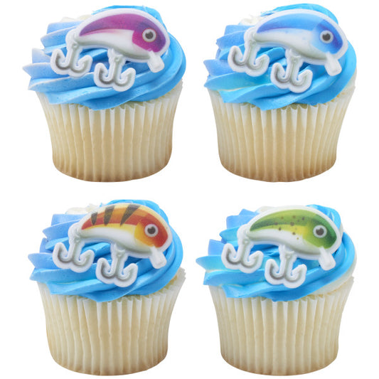 Vanilla cupcakes with blue frosting topped with colorful fishing lure cupcake rings.