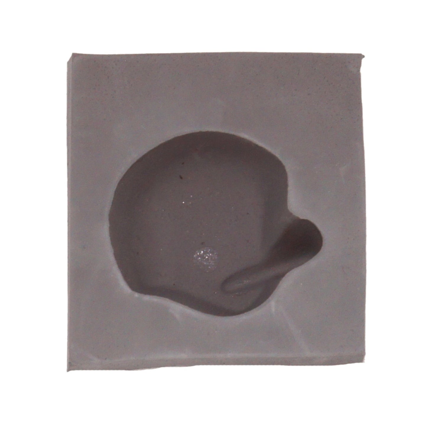 Close-up of a football helmet-shaped cavity in a natural rubber mint mold, ideal for themed cream cheese mints, chocolates, or fondant decorations.