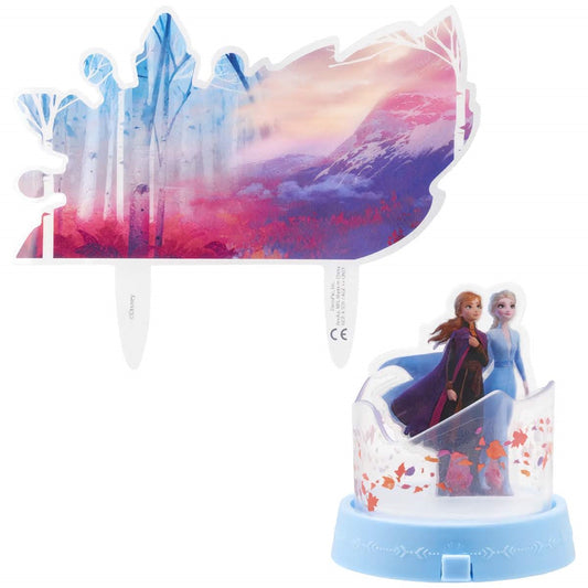 Frozen II cake decorating kit, presenting a stunning display of the movie's iconic characters Elsa and Anna on a mystical journey backdrop, transforming any cake into a winter wonderland adventure, available at Lynn's Cake, Candy, and Chocolate Supplies.