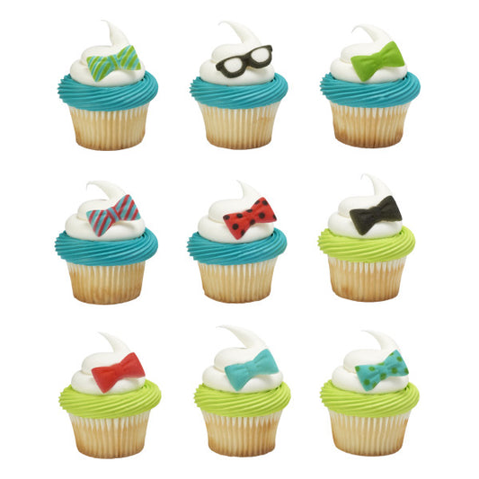 Cupcakes topped with swirled frosting and Geek sugar decorations including striped, polka dot, and solid bow ties, plus black glasses.