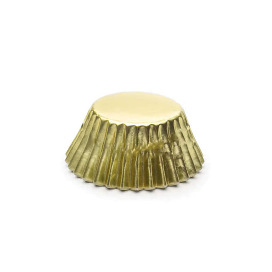 Metallic mini foil baking cup in gold with fluted sides, shown upside down on a white background.
