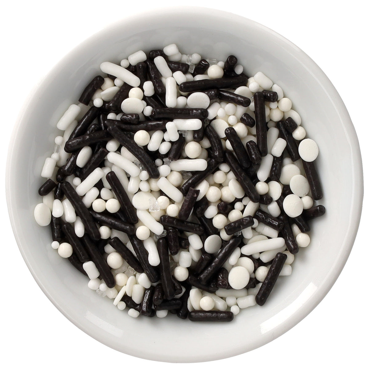 White bowl filled with Graduation Natural Dyed Made Simply™ Sprinkle Blend featuring black and white rod sprinkles, round pearls, flat quins, and small sugar pieces.