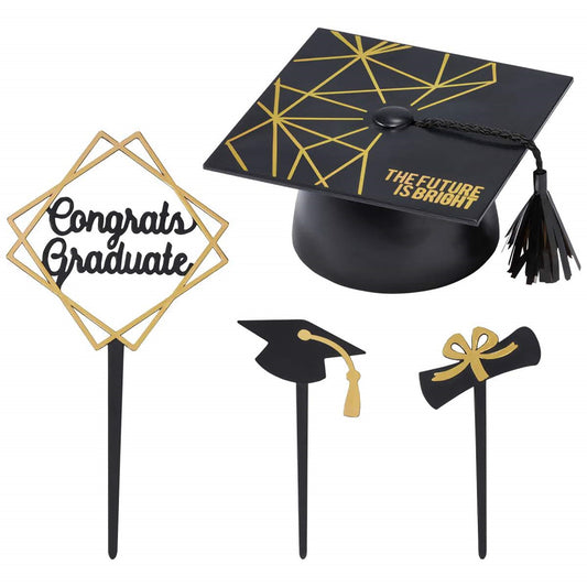Elegant four-piece graduation cake topper set including a 'Congrats Graduate' sign, a mortarboard, a diploma, and a bow.