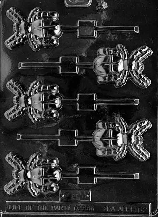 Spider Lollipop mold creating large spider-shaped chocolate pops.