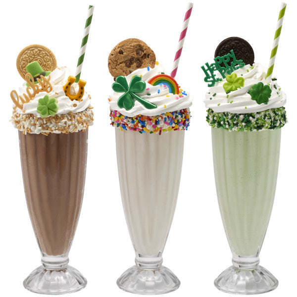 Trio of milkshakes topped with whipped cream, cookies, sprinkles, and various St. Patrick’s Day picks including “Happy St. Pat’s”
