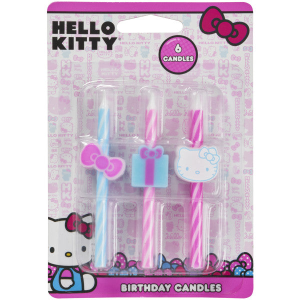 Package of 6 Hello Kitty birthday candles with pink and blue swirls and themed toppers including a bow, gift, and Hello Kitty face.