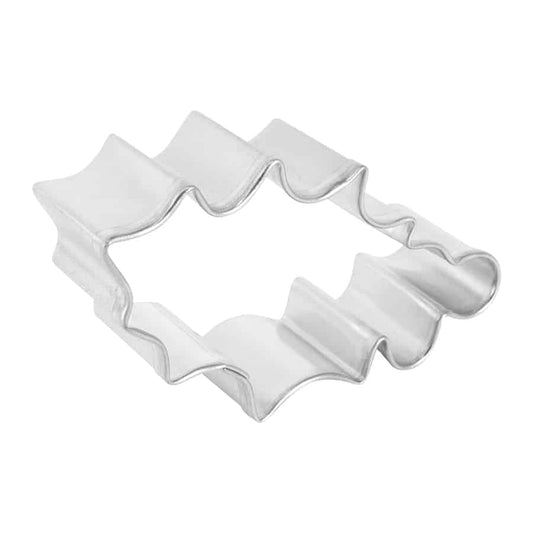 Angled view of a holly leaf-shaped tin cookie cutter.
