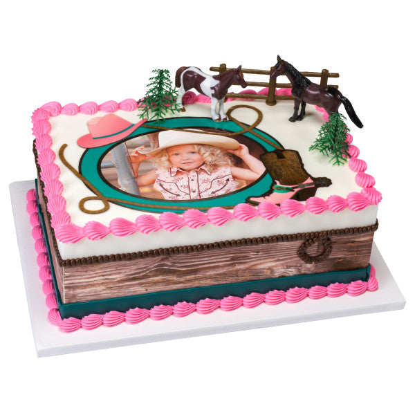 Decorated sheet cake with photo insert and horses cake topper set, including horses, trees, and a fence.