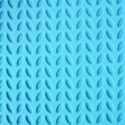 Close-up of barley twist pattern created with PME Impression Mat on blue fondant.