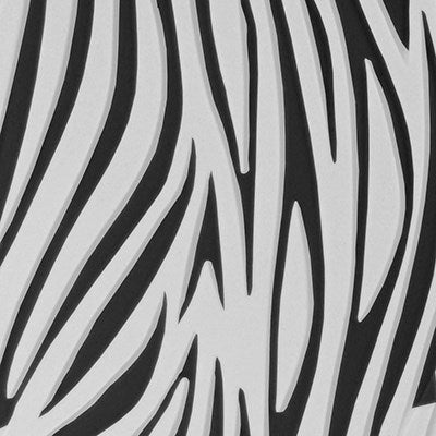 Close-up of bold zebra stripe pattern from PME Impression Mat on black and white fondant.