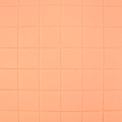 Embossed orange fondant with a small square pattern made using PME impression mat.