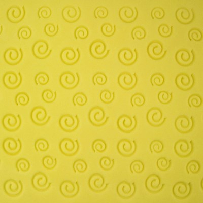 Swirl texture pattern embossed on yellow fondant using PME impression mat.