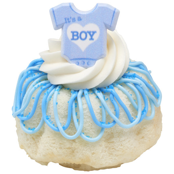 Mini bundt cake decorated with blue icing and an "It's a Boy" baby shower ring topper