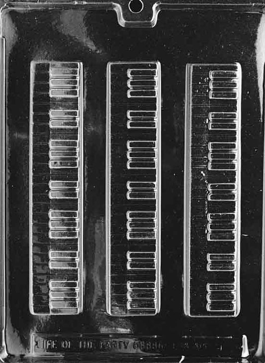 Image shows PIANO KEYBOARD mold with long, narrow cavity featuring piano keys in raised detail.