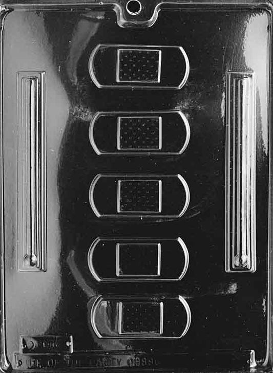 Image shows BANDAID AND THERMOMETER mold with two distinct cavities, one for a chocolate bandaid and one for a thermometer.