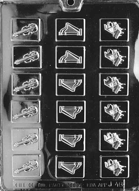 Image of MUSICAL MINTS mold with tiny cavities shaped like musical symbols.