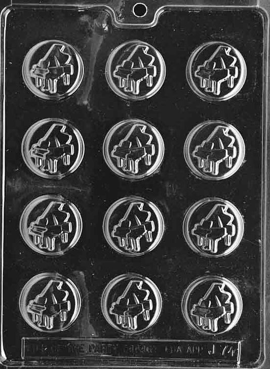 Image of PIANO MINT mold showing round chocolate cavity with piano key imprint.