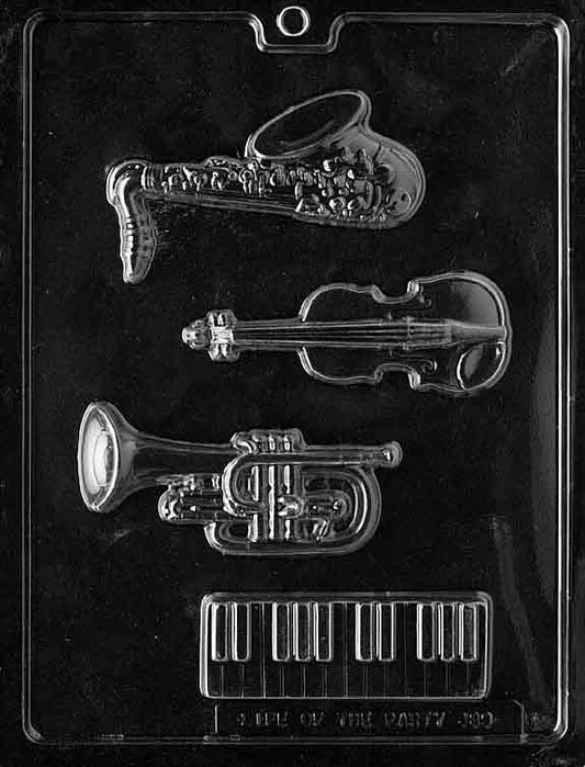 Image of MUSIC KIT mold featuring musical-themed chocolate cavities including instruments and notes.
