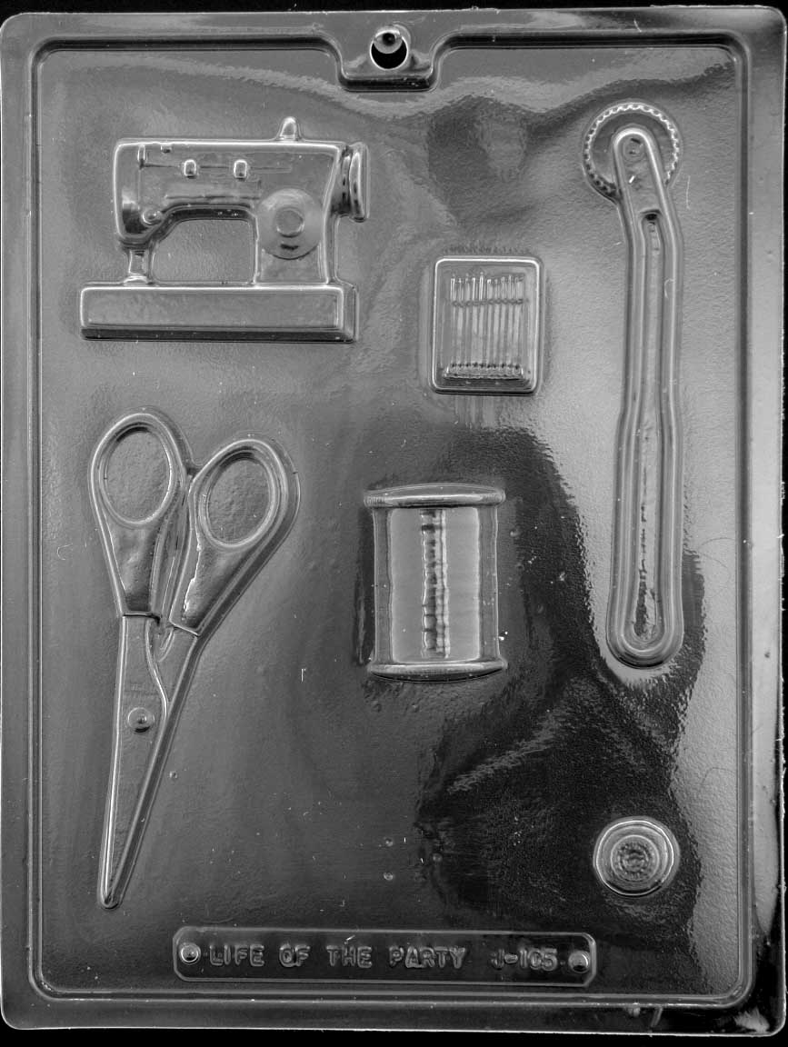 Image of SEWING KIT mold featuring chocolate shapes like a sewing machine, scissors, thimble, and needle.