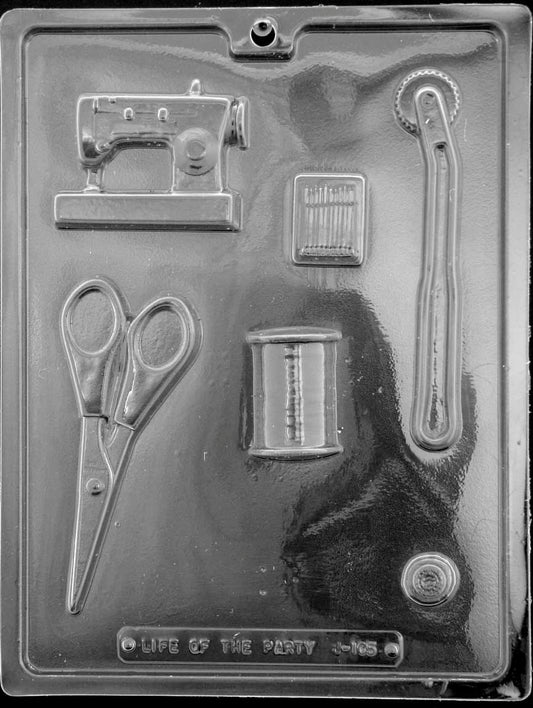 Image of SEWING KIT mold featuring chocolate shapes like a sewing machine, scissors, thimble, and needle.