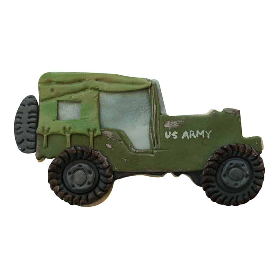 Decorated military truck cookie with army green icing, black tires, and realistic details.