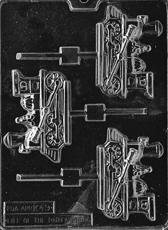 Image of K049 chocolate mold with train engine-shaped Lollipop cavities, featuring smokestack and wheel detailing.