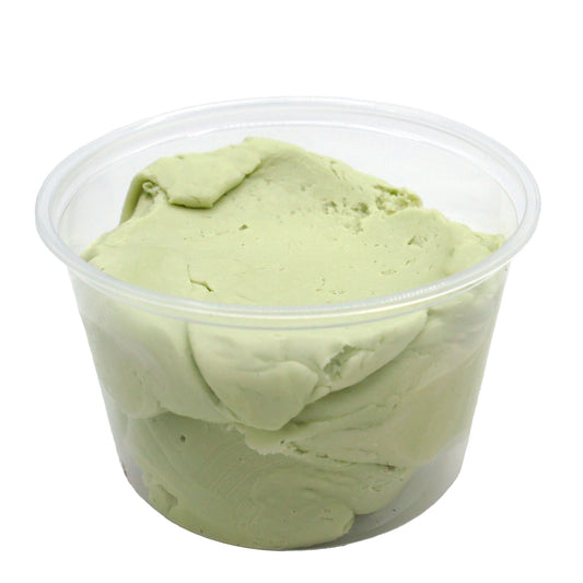 Clear plastic container filled with pale green key lime candy center, ready for shaping and dipping.