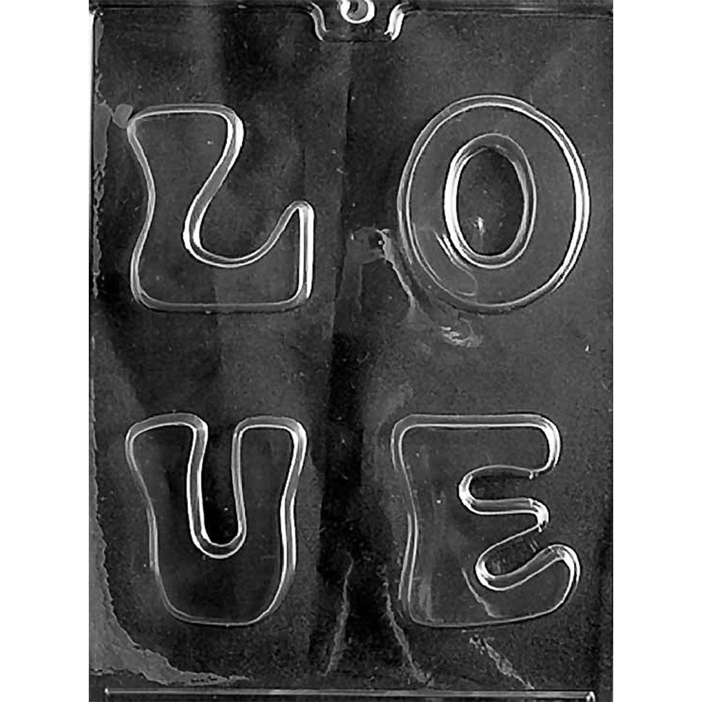 Clear plastic chocolate mold with four separate letter cavities forming L, O, V, and E in chunky block style; shown on a dark background for contrast.
