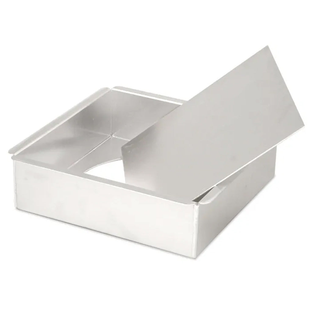 Square aluminum cake pan with straight sides and a removable bottom insert, shown partially lifted inside the pan on a white background.