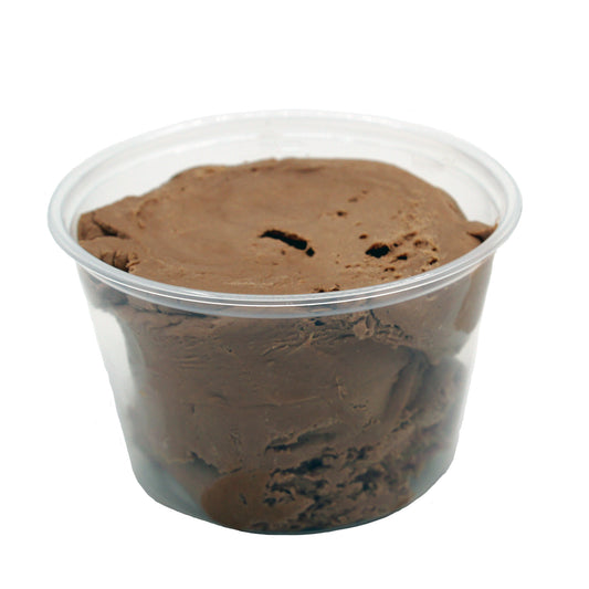 Clear plastic container filled with soft, scoopable maple candy center, ready for shaping and dipping into chocolate.