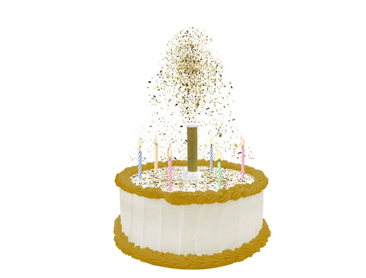 A birthday cake with candles and a Party Popper Cake Topper launching colorful edible confetti.