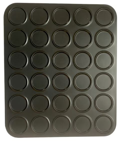 Top-down view of a Fox Run Mini Macaron Pan with 30 round cavities for uniform mini pastries, perfect for baking mini macarons or cookies