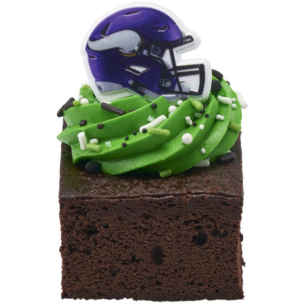 Chocolate brownie topped with green frosting and a Minnesota Vikings helmet ring.