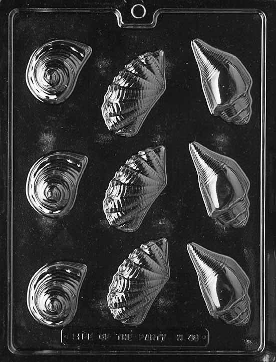 N048 SHELL ASSORTMENT chocolate mold featuring several small shell cavities with ribbed and spiral textures for coastal candies.