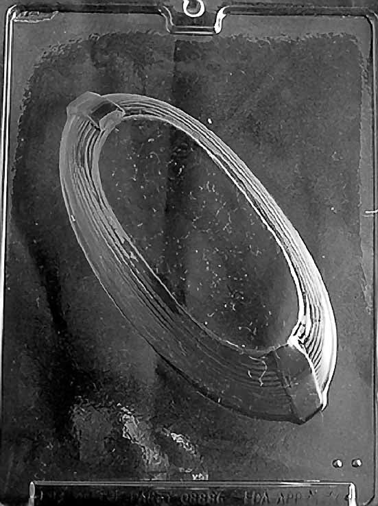 Clear plastic chocolate mold showing a large boat-shaped cavity with curved sides, designed to create a 3D Noah’s Ark chocolate base.