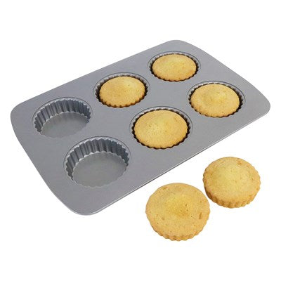 Mini tarts baked in PME 6 Cup Tart Pan with two golden-brown tart shells displayed.