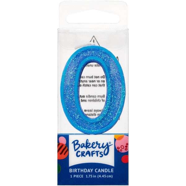 Glittery blue number zero 1.75" birthday candle in packaging from Bakery Crafts.