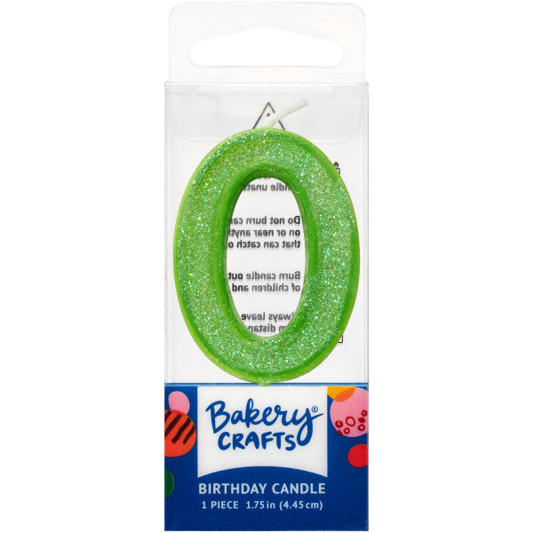 Glittery lime number zero 1.75" birthday candle in packaging from Bakery Crafts.