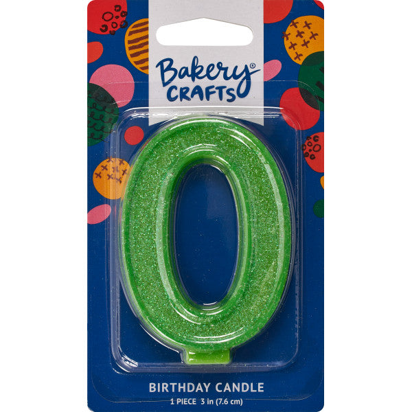 Glittery green number zero 3" birthday candle in packaging from Bakery Crafts.
