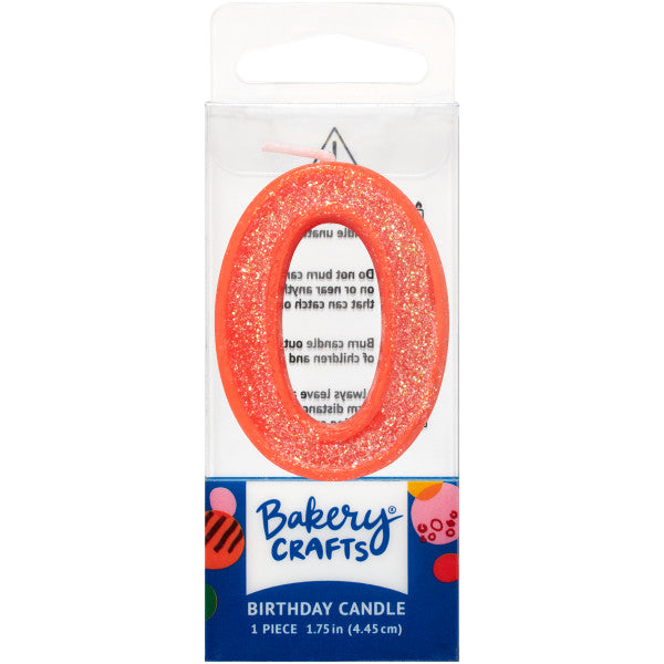 Glittery orange number zero 1.75" birthday candle in packaging from Bakery Crafts.