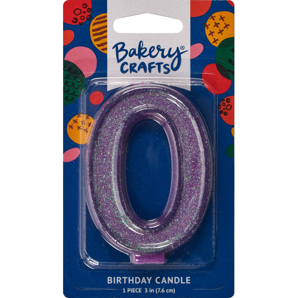 Glittery purple number zero 3" birthday candle in packaging from Bakery Crafts.